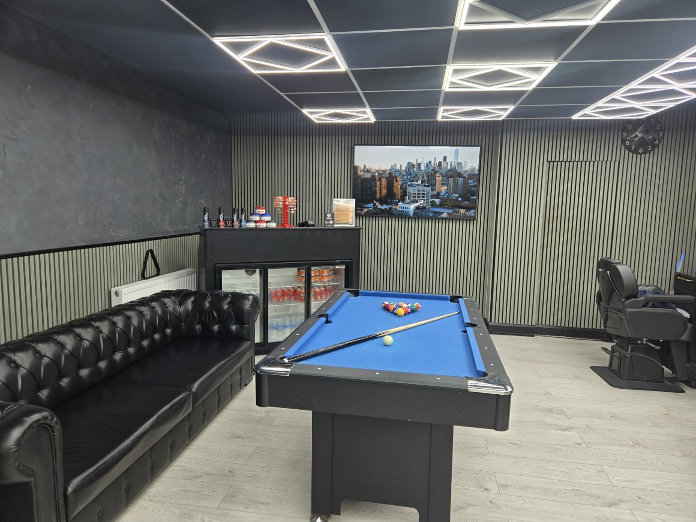Pool table and customer lounge inside Wimborne Barbers